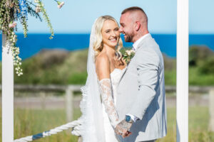 bride and groom smiling after ceremony at caves coastal bar and bungalows